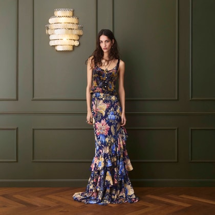 Model wearing an Etro floral-print sleeveless maxi dress with layered ruffle hem in blue and multicolor tones.