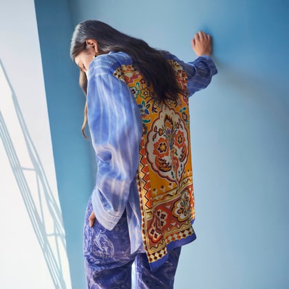Model wearing a Etro Summer striped cotton shirt with silk detail