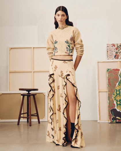 Model wearing a flowing Etro skirt and a knitwear of FW25 collection