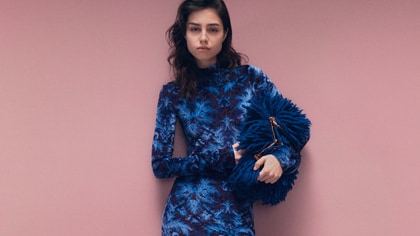 Model in a Etro chenille jacquard dress with pink background