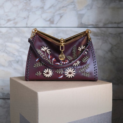 MEDIUM LEATHER VELA BAG WITH THREADING AND FLORAL MOTIF