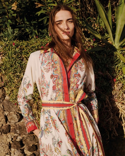Woman wearing a flowing Etro paisley dress