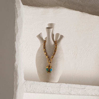 Gold chain necklace with turquoise-accented pendant from Etro.