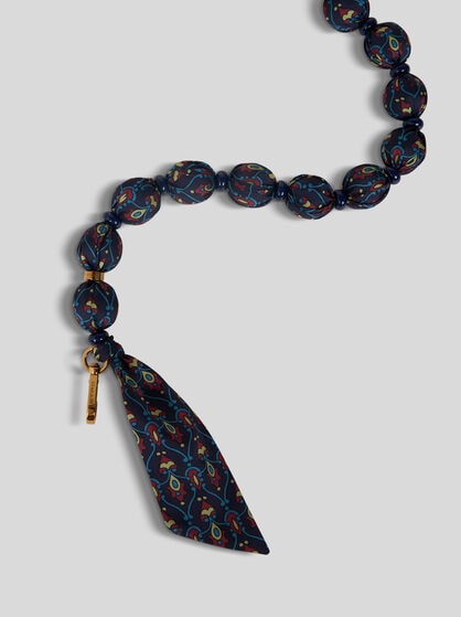 HANDLE WITH PRINTED FABRIC SPHERES AND BEADS
