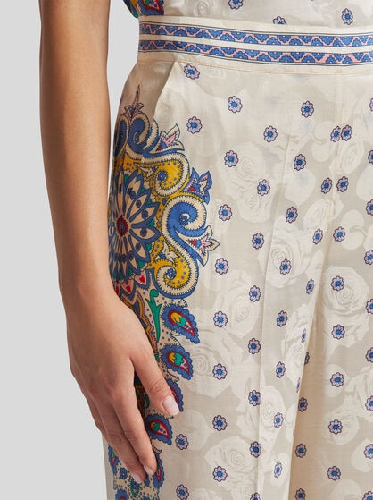 TROUSERS WITH MEDALLION MOTIF