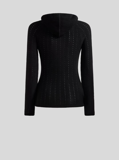 KNIT TOP WITH CROSSOVER AND PUNCHED DETAIL