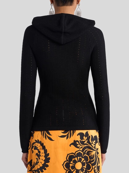 KNIT TOP WITH CROSSOVER AND PUNCHED DETAIL